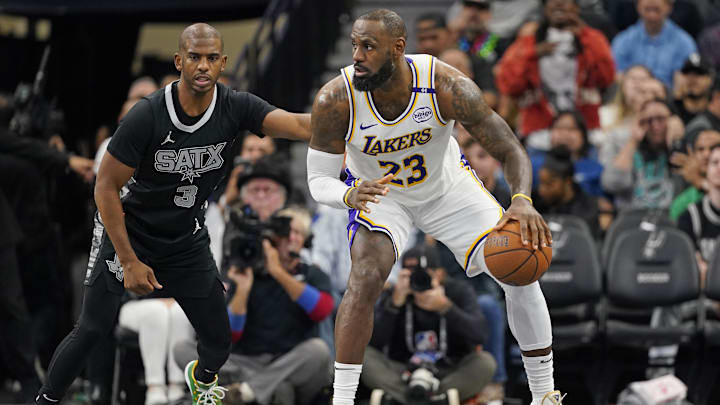 Nov 15, 2024; San Antonio, Texas, USA; Los Angeles Lakers forward LeBron James (23) looks to pass the ball while defended by San Antonio Spurs guard Chris Paul (3) during the first half during the first half at Frost Bank Center. Nov 15, 2024; San Antonio, Texas, USA; Los Angeles Lakers forward LeBron James (23) looks to pass the ball while defended by San Antonio Spurs guard Chris Paul (3) during the first half during the first half at Frost Bank Center.