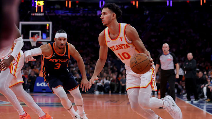 Dec 11, 2024; New York, New York, USA; Atlanta Hawks forward Zaccharie Risacher (10) drives to the basket against New York Knicks guard Josh Hart (3) during the second quarter at Madison Square Garden. Mandatory Credit: Brad Penner-Imagn Images