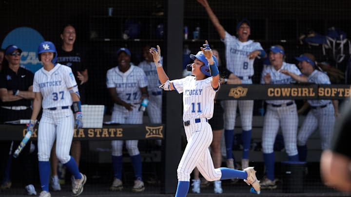 Kentucky outfielder Vanessa Nesby (11) scores the game-winning run in the seventh inning of a softball game against Michigan in the first round of the Stillwater Regional of the NCAA Tournament in Stillwater, Okla., Friday, May 17, 2024.