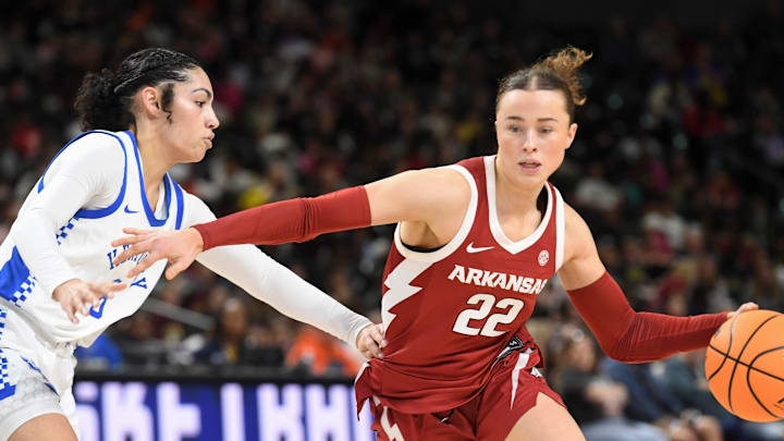 Kentucky Wildcats guard Asia Boone (8) defends Arkansas Razorbacks guard Bonnie Deas (22) Wednesday, March 4, 2026, during the SEC Women's Basketball Tournament first round game at Bon Secours Wellness Arena in Greenville, South Carolina.