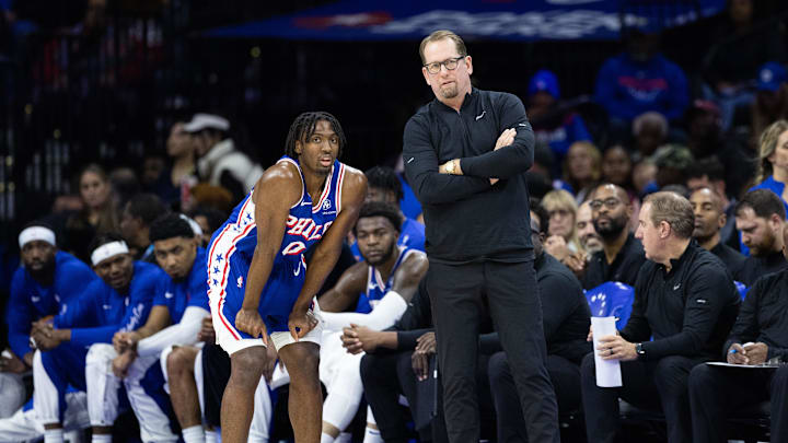 Nov 2, 2023; Philadelphia, Pennsylvania, USA; Philadelphia 76ers head coach Nick Nurse talks with guard Tyrese Maxey (0) during the second quarter against the Toronto Raptors at Wells Fargo Center. Mandatory Credit: Bill Streicher-Imagn Images
