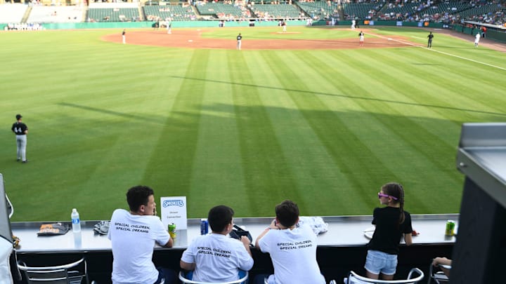 Children watch the Tennessee Smokies baseball game against the Chattanooga Lookouts at The Dream Connection's reunion and celebration on Tuesday, May 28, 2024 in Sevierville, Tenn.