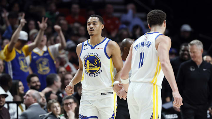 Feb 8, 2023; Portland, Oregon, USA; Golden State Warriors shooting guard Jordan Poole (3) celebrates a three-point shot with Klay Thompson (11) during the first half against the Portland Trail Blazers at Moda Center. Mandatory Credit: Soobum Im-Imagn Images