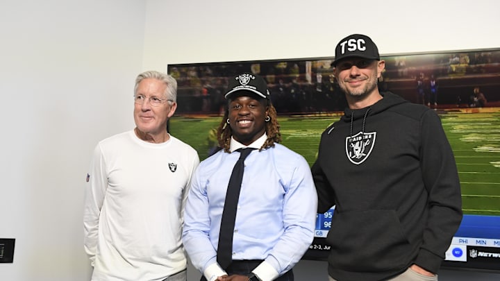 Apr 25, 2025; Henderson, NV, USA; (L-R) Las Vegas Raiders head coach Pete Carroll, Ashton Jeanty and general manager John Spytek pose after a news conference introducing Jeanty as the first round draft pick in the 2025 NFL Draft at Intermountain Health Performance Center. Mandatory Credit: Candice Ward-Imagn Images Apr 25, 2025; Henderson, NV, USA; (L-R) Las Vegas Raiders head coach Pete Carroll, Ashton Jeanty and general manager John Spytek pose after a news conference introducing Jeanty as the first round draft pick in the 2025 NFL Draft at Intermountain Health Performance Center. Mandatory Credit: Candice Ward-Imagn Images