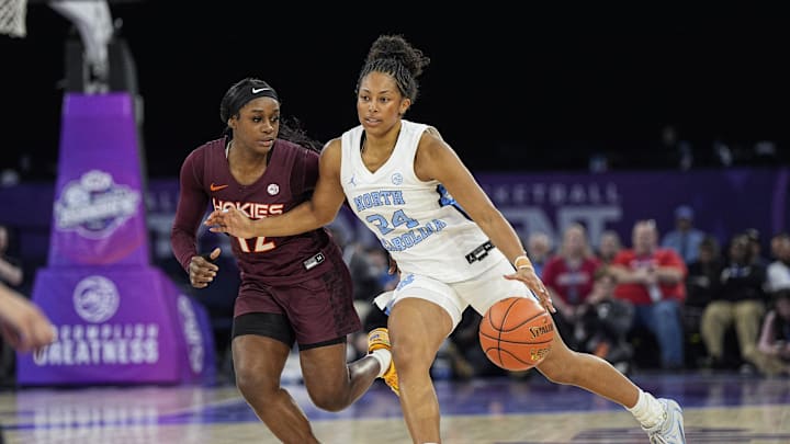 Mar 6, 2026; Duluth, GA, USA; North Carolina Tar Heels guard Indya Nivar (24) dribbles past Virginia Tech Hokies guard Samyha Suffren (12) at Gas South Arena. Mandatory Credit: Dale Zanine-Imagn Images