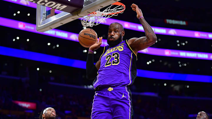 Feb 6, 2025; Los Angeles, California, USA;  Los Angeles Lakers forward LeBron James (23) dunks for the basket against the against the Golden State Warriors during the first half at Crypto.com Arena. Mandatory Credit: Gary A. Vasquez-Imagn Images