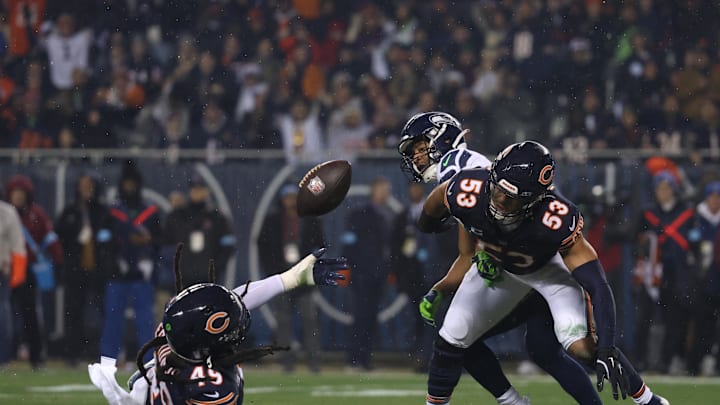 Chicago Bears linebacker Tremaine Edmunds (49) and linebacker T.J. Edwards (53) attempt to secure an incomplete Seattle Seahawks pass. 