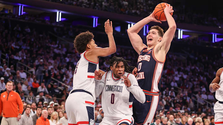 Nov 28, 2025; New York, New York, USA; Illinois Fighting Illini forward David Mirkovic (0) collides with UConn Huskies guard Malachi Smith (0) in the second half at Madison Square Garden. Mandatory Credit: Wendell Cruz-Imagn Images Nov 28, 2025; New York, New York, USA; Illinois Fighting Illini forward David Mirkovic (0) collides with UConn Huskies guard Malachi Smith (0) in the second half at Madison Square Garden. Mandatory Credit: Wendell Cruz-Imagn Images