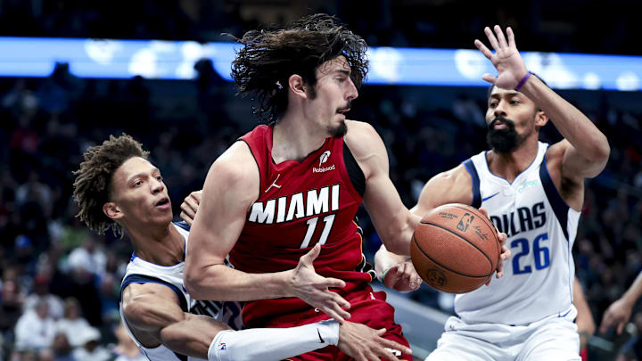 Feb 13, 2025; Dallas, Texas, USA;  Miami Heat guard Jaime Jaquez Jr. (11) controls the ball as Dallas Mavericks guard Spencer Dinwiddie (26) and Dallas Mavericks forward Kessler Edwards (20) defend during the second half at American Airlines Center. Mandatory Credit: Kevin Jairaj-Imagn Images