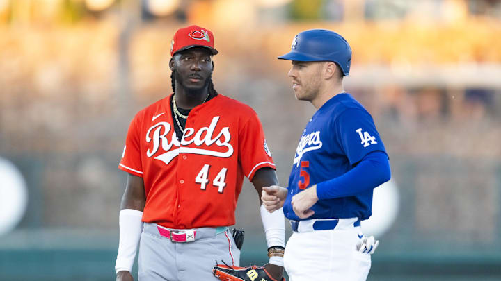 Mar 12, 2026; Phoenix, Arizona, USA; Los Angeles Dodgers first baseman Freddie Freeman (right) with Cincinnati Reds shortstop Elly De La Cruz during a spring training game at Camelback Ranch-Glendale. Mandatory Credit: Mark J. Rebilas-Imagn Images
