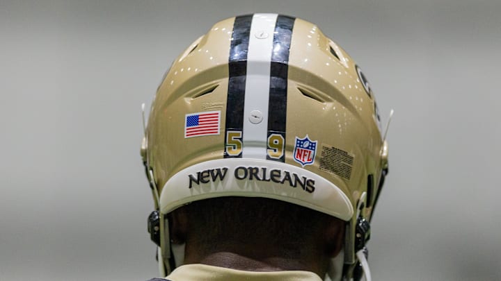 May 10, 2025; New Orleans, LA, USA; Detailed view of the New Orleans Saints helmet during rookie minicamp at Ochsner Sports Performance Center. Mandatory Credit: Stephen Lew-Imagn Images May 10, 2025; New Orleans, LA, USA; Detailed view of the New Orleans Saints helmet during rookie minicamp at Ochsner Sports Performance Center. Mandatory Credit: Stephen Lew-Imagn Images