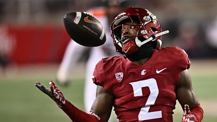 Nov 29, 2025; Pullman, Washington, USA; Washington State Cougars defensive back Colby Humphrey (2) makes the jugging interception against the Oregon State Beavers in the second half at Gesa Field at Martin Stadium. Washington State Cougars won 32-8. Mandatory Credit: James Snook-Imagn Images