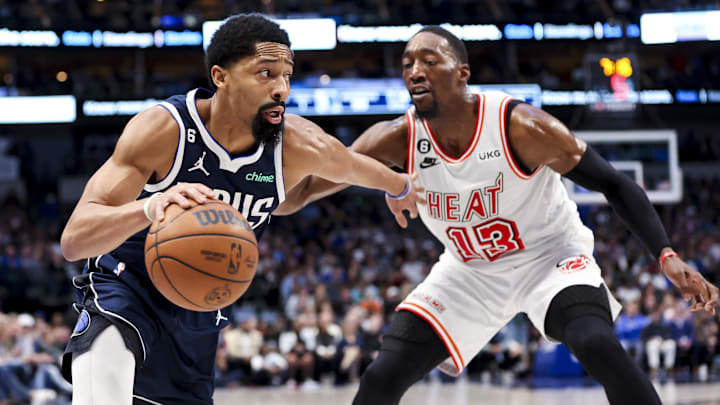 Jan 20, 2023; Dallas, Texas, USA;  Dallas Mavericks guard Spencer Dinwiddie (26) drives to the basket as Miami Heat center Bam Adebayo (13) defends during the fourth quarter at American Airlines Center. Mandatory Credit: Kevin Jairaj-Imagn Images