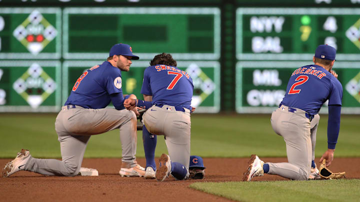 Apr 30, 2025; Pittsburgh, Pennsylvania, USA; Chicago Cubs left fielder Ian Happ (8) and shortstop Dansby Swanson (7) and second baseman Nico Hoerner (2) are visibly shaken as Pittsburgh Pirates medical personnel (not pictured) cart a fan who fell from the stands to the field to an ambulance as the Pirates batted against the Chicago Cubs during the seventh inning at PNC Park. Apr 30, 2025; Pittsburgh, Pennsylvania, USA; Chicago Cubs left fielder Ian Happ (8) and shortstop Dansby Swanson (7) and second baseman Nico Hoerner (2) are visibly shaken as Pittsburgh Pirates medical personnel (not pictured) cart a fan who fell from the stands to the field to an ambulance as the Pirates batted against the Chicago Cubs during the seventh inning at PNC Park.