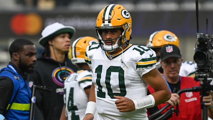 Green Bay Packers quarterback Jordan Love (10) jogs onto the field at SoFi Stadium.