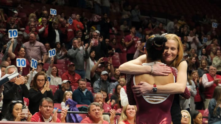 Mar 8, 2024; Tuscaloosa, Alabama, USA; Alabama head coach Ashley Johnston hugs Alabama gymnast Luisa
