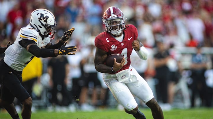 Oct 26, 2024; Tuscaloosa, Alabama, USA; Alabama Crimson Tide quarterback Jalen Milroe (4) carries the ball against Missouri Tigers safety Sidney Williams (3) during the third quarter at Bryant-Denny Stadium. Mandatory Credit: Will McLelland-Imagn Images