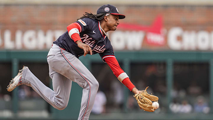Sep 24, 2025; Cumberland, Georgia, USA; Washington Nationals shortstop CJ Abrams (5) fields a ball hit by Atlanta Braves right fielder Ronald Acuna Jr (13) (not shown) during the ninth inning at Truist Park. Mandatory Credit: Dale Zanine-Imagn Images