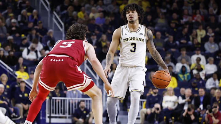 Jan 20, 2026; Ann Arbor, Michigan, USA;  Michigan Wolverines guard Elliot Cadeau (3) dribbles defended by Indiana Hoosiers guard Conor Enright (5) in the first half at Crisler Center. Mandatory Credit: Rick Osentoski-Imagn Images
