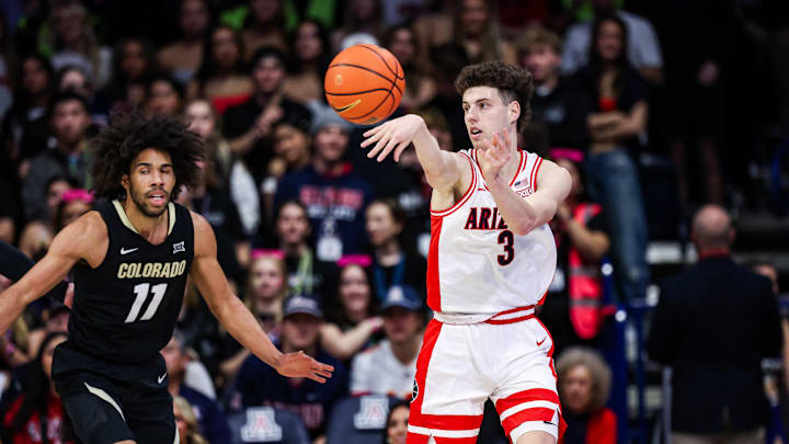 Jan 25, 2025; Tucson, Arizona, USA; Arizona Wildcats guard Anthony Dell’Orso (3) passes the ball while Colorado Buffaloes guard Javon Ruffin (11) watches during the first half at McKale Center. Mandatory Credit: Aryanna Frank-Imagn Images