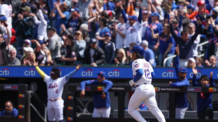 Apr 20, 2025; New York City, New York, USA;  New York Mets shortstop Francisco Lindor (12) hits a solo home run during the first inning against the St. Louis Cardinals at Citi Field. Mandatory Credit: Vincent Carchietta-Imagn Images