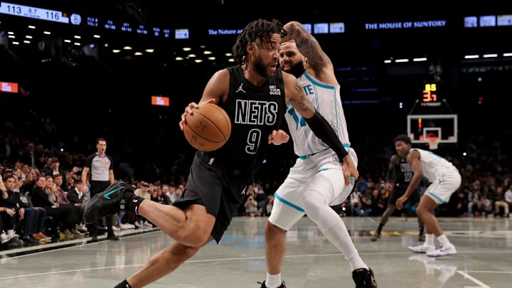 Nov 19, 2024; Brooklyn, New York, USA; Brooklyn Nets forward Trendon Watford (9) drives to the basket against Charlotte Hornets forward Cody Martin (11) during the fourth quarter at Barclays Center. Mandatory Credit: Brad Penner-Imagn Images