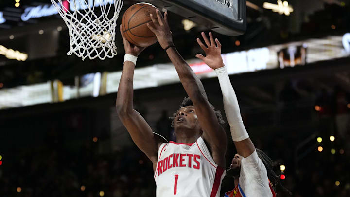 Dec 14, 2024; Las Vegas, Nevada, USA; Houston Rockets forward Amen Thompson (1) shoots against Oklahoma City Thunder guard Isaiah Joe (11) during the fourth quarter in a semifinal of the 2024 Emirates NBA Cup at T-Mobile Arena. Mandatory Credit: Kyle Terada-Imagn Images