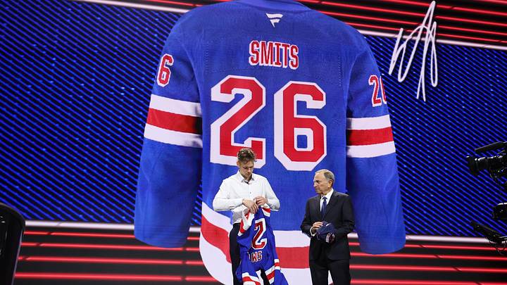 Jun 26, 2026; Buffalo, New York, USA; Alberts Smits reacts beside NHL commissioner Gary Bettman after being selected with the fifth pick in the first round of the 2026 NHL Draft by the New York Rangers at KeyBank Center.