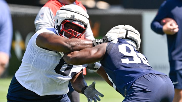 Jul 23, 2025; Foxborough, MA, USA; New England Patriots guard Mehki Butler (63) does a drill with defensive tackle David Olajija (96) during training camp at Gillette Stadium. Mandatory Credit: Eric Canha-Imagn Images