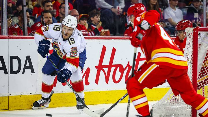 Mar 20, 2026; Calgary, Alberta, CAN; Florida Panthers left wing Matthew Tkachuk (19) controls the puck against the Calgary Flames during the first period at Scotiabank Saddledome. Mandatory Credit: Sergei Belski-Imagn Images