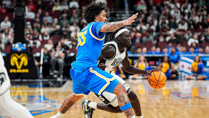 Michigan State guard Kur Teng (2) dribbles against UCLA guard Skyy Clark (55) during the second half of Big Ten tournament quarterfinal at United Center in Chicago on Friday, March 13, 2026.