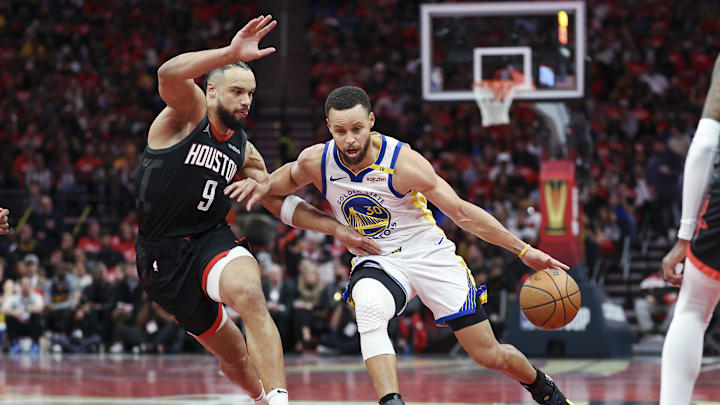 Golden State Warriors guard Stephen Curry (30) drives with the ball as Houston Rockets forward Dillon Brooks (9) defends during the first quarter at Toyota Center. Mandatory Credit: Troy Taormina-Imagn Images
