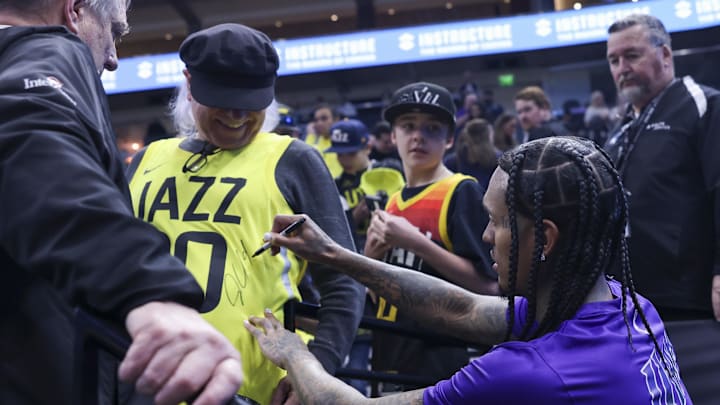 Mar 18, 2024; Salt Lake City, Utah, USA; Utah Jazz guard Jordan Clarkson (00) signs autographs for Mar 18, 2024; Salt Lake City, Utah, USA; Utah Jazz guard Jordan Clarkson (00) signs autographs for