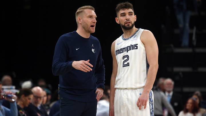 Mar 20, 2026; Memphis, Tennessee, USA; Memphis Grizzlies head coach Tuomas Iisalo talks with guard Ty Jerome (2) during the second quarter against the Boston Celtics at FedExForum. Mandatory Credit: Petre Thomas-Imagn Images