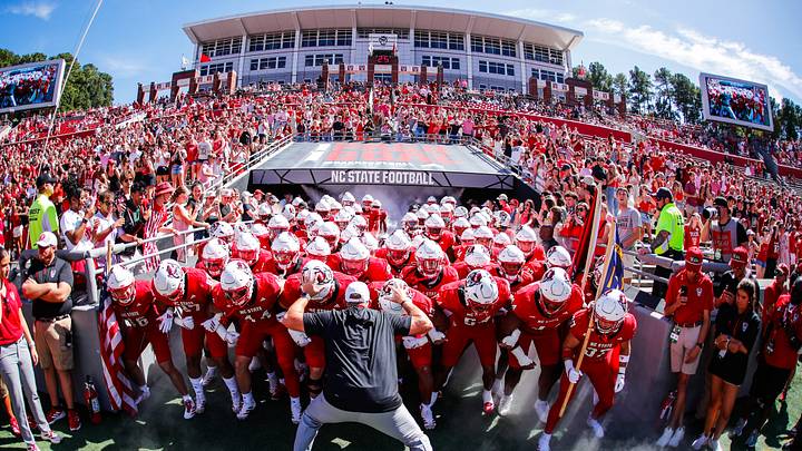 Oct 4, 2025; Raleigh, North Carolina, USA; NC State Wolfpack head coach Dave Doeren with his team prepare to run out prior to the first half of the game against Campbell Fighting Camels at Carter-Finley Stadium. Mandatory Credit: Jaylynn Nash-Imagn Images Oct 4, 2025; Raleigh, North Carolina, USA; NC State Wolfpack head coach Dave Doeren with his team prepare to run out prior to the first half of the game against Campbell Fighting Camels at Carter-Finley Stadium. Mandatory Credit: Jaylynn Nash-Imagn Images
