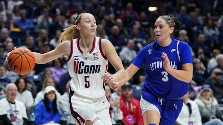 Jan 19, 2025; Storrs, Connecticut, USA; UConn Huskies guard Paige Bueckers (5) looks for an opening against Seton Hall Pirates forward Faith Masonius (3) in the first half at Harry A. Gampel Pavilion. Mandatory Credit: David Butler II-Imagn Images Jan 19, 2025; Storrs, Connecticut, USA; UConn Huskies guard Paige Bueckers (5) looks for an opening against Seton Hall Pirates forward Faith Masonius (3) in the first half at Harry A. Gampel Pavilion. Mandatory Credit: David Butler II-Imagn Images