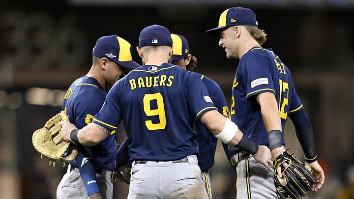 Oct 7, 2026; San Diego, California, USA;  Milwaukee Brewers infielders celebrate after the game against the San Diego Padres in game four of the NLDS for the 2026 MLB Playoffs at Petco Park.  Mandatory Credit: Denis Poroy-Imagn Images