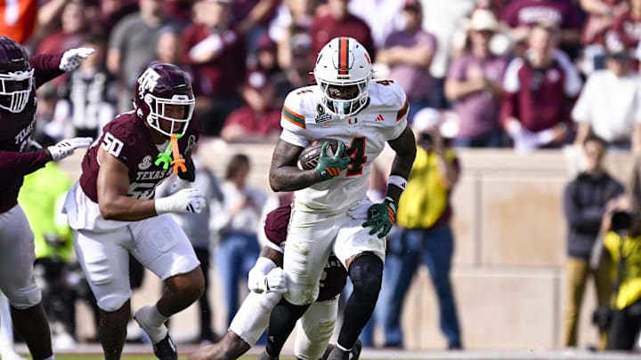 Dec 20, 2025; College Station, TX, USA; Miami Hurricanes running back Mark Fletcher Jr. (4) runs with the ball during the game between the Aggies and the Hurricanes at Kyle Field. Mandatory Credit: Jerome Miron-Imagn Images