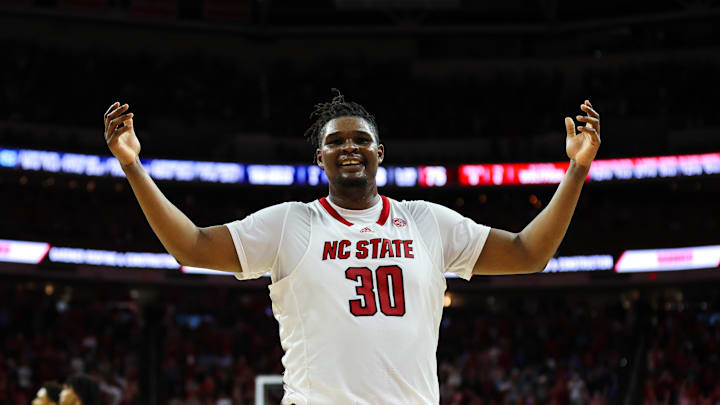 Feb 19, 2023; Raleigh, North Carolina, USA;  North Carolina State Wolfpack forward D.J. Burns Jr. (30) celebrates during the second half of the game against North Carolina Tar Heels at PNC Arena. Mandatory Credit: Jaylynn Nash-USA TODAY Sports