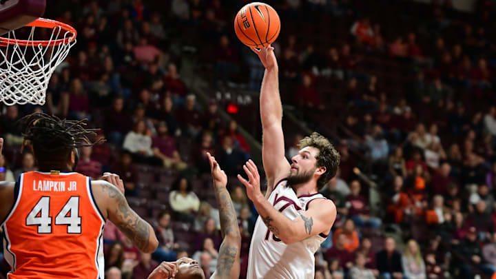 Mar 1, 2025; Blacksburg, Virginia, USA;  Virginia Tech Hokies forward Ben Burnham (13) attempts a shot over Syracuse Orange forward Jyare Davis (13) during the second half at Cassell Coliseum. Mandatory Credit: Brian Bishop-Imagn Images