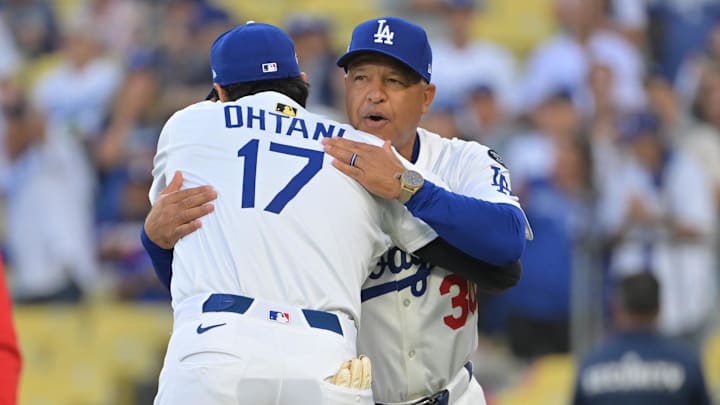 Sep 30, 2025; Los Angeles, California, USA; Los Angeles Dodgers designated hitter Shohei Ohtani (17) gets a hug from manager Dave Roberts (30) as they are introduced for game one of the Wildcard round for the 2025 MLB playoffs against the Cincinnati Reds at Dodger Stadium. Mandatory Credit: Jayne Kamin-Oncea-Imagn Images Sep 30, 2025; Los Angeles, California, USA; Los Angeles Dodgers designated hitter Shohei Ohtani (17) gets a hug from manager Dave Roberts (30) as they are introduced for game one of the Wildcard round for the 2025 MLB playoffs against the Cincinnati Reds at Dodger Stadium. Mandatory Credit: Jayne Kamin-Oncea-Imagn Images