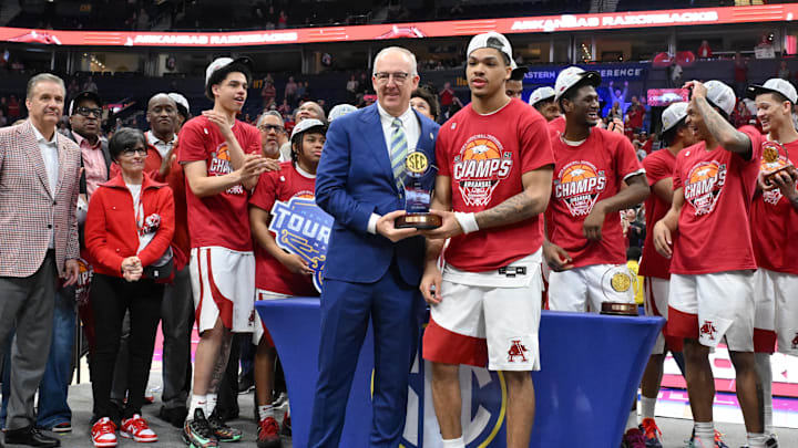 Mar 15, 2026; Nashville, TN, USA; SEC president Greg Sankey poses with Arkansas Razorbacks guard Darius Acuff Jr. (5) as he receives his tournament MVP trophy after the men's SEC Conference Tournament Championship against the Vanderbilt Commodores at Bridgestone Arena. Mandatory Credit: Steve Roberts-Imagn Images