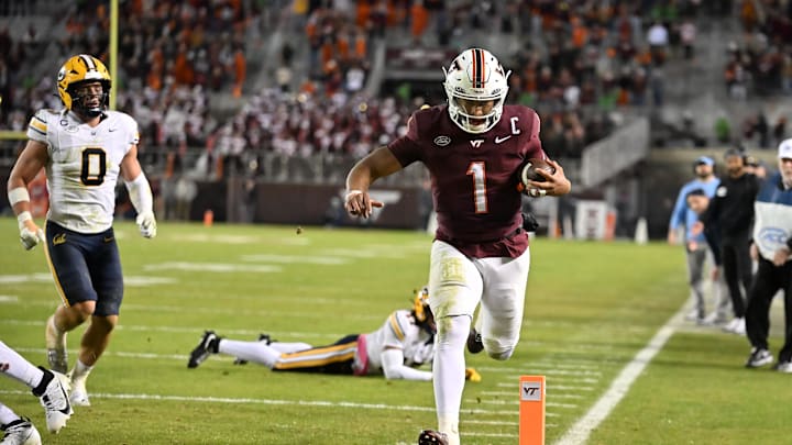 Oct 24, 2025; Blacksburg, V.; Virginia Tech quarterback Kyron Drones (1) runs for a touchdown against California.