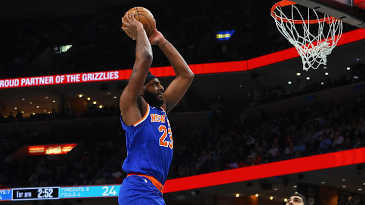 Feb 28, 2025; Memphis, Tennessee, USA; New York Knicks center Mitchell Robinson (23) dunks during the first quarter against the Memphis Grizzlies at FedExForum. Mandatory Credit: Petre Thomas-Imagn Images