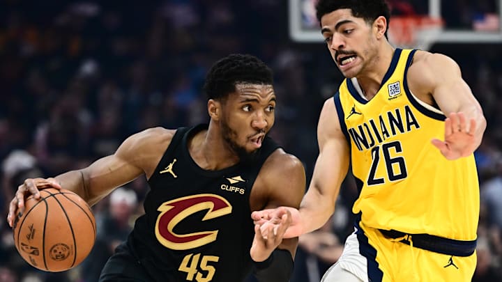 May 13, 2025; Cleveland, Ohio, USA; Cleveland Cavaliers guard Donovan Mitchell (45) drives to the basket against Indiana Pacers guard Ben Sheppard (26) during the first half of game five of the second round for the 2025 NBA Playoffs at Rocket Arena. Mandatory Credit: Ken Blaze-Imagn Images