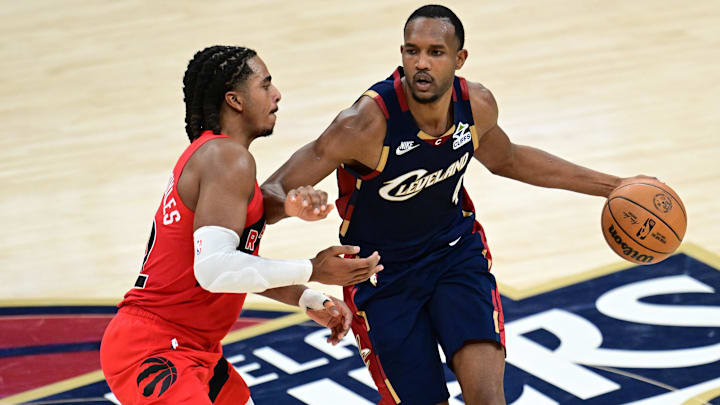 Apr 20, 2026; Cleveland, Ohio, USA; Cleveland Cavaliers center Evan Mobley (4) drives on Toronto Raptors forward Collin Murray-Boyles (12) during the second half during game two of the first round of the 2026 NBA Playoffs at Rocket Arena. Mandatory Credit: David Dermer-Imagn Images