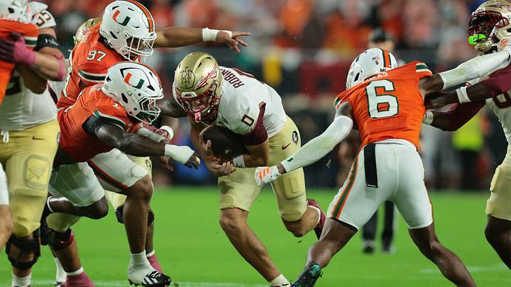 Oct 17, 2026; Miami Gardens, Florida, USA; Florida State Seminoles wide receiver Duce Robinson (0) runs during the first quarter Miami Hurricanes linebacker Mohamed Toure (1) and defensive back Xavier Lucas (6)at Hard Rock Stadium. Mandatory Credit: Sam Navarro-Imagn Images Oct 17, 2026; Miami Gardens, Florida, USA; Florida State Seminoles wide receiver Duce Robinson (0) runs during the first quarter Miami Hurricanes linebacker Mohamed Toure (1) and defensive back Xavier Lucas (6)at Hard Rock Stadium. Mandatory Credit: Sam Navarro-Imagn Images