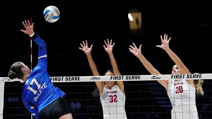 Kentucky Wildcats outside hitter Brooklyn Deleye (17) attacks the ball as Wisconsin Badgers outside hitter Grace Egan (32) and Wisconsin Badgers middle blocker Lynney Tarnow (20) jump to block during the third set of their match at the AVCA First Serve event at Fiserv Forum in Milwaukee, Wisconsin on Aug. 21, 2026. Kentucky Wildcats outside hitter Brooklyn Deleye (17) attacks the ball as Wisconsin Badgers outside hitter Grace Egan (32) and Wisconsin Badgers middle blocker Lynney Tarnow (20) jump to block during the third set of their match at the AVCA First Serve event at Fiserv Forum in Milwaukee, Wisconsin on Aug. 21, 2026.