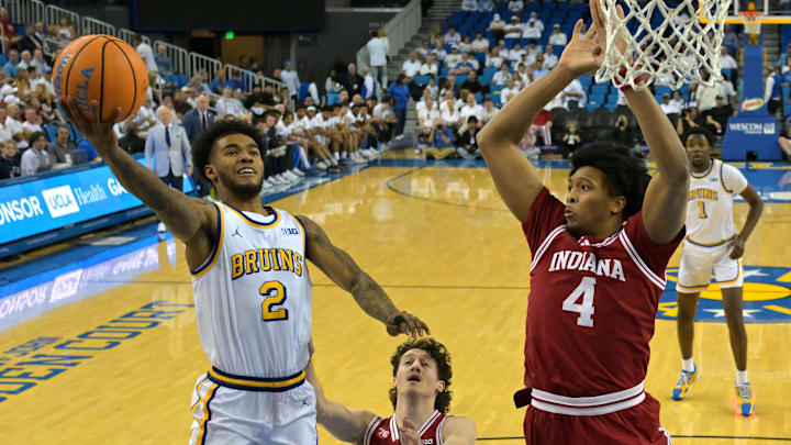 Jan 31, 2026; Los Angeles, California, USA; UCLA Bruins guard Donovan Dent (2) as he drives to the basket past Indiana Hoosiers guard Conor Enright (5) and forward Sam Alexis (4) in the first half at Pauley Pavilion presented by Wescom Financial. Mandatory Credit: Jayne Kamin-Oncea-Imagn Images Jan 31, 2026; Los Angeles, California, USA; UCLA Bruins guard Donovan Dent (2) as he drives to the basket past Indiana Hoosiers guard Conor Enright (5) and forward Sam Alexis (4) in the first half at Pauley Pavilion presented by Wescom Financial. Mandatory Credit: Jayne Kamin-Oncea-Imagn Images