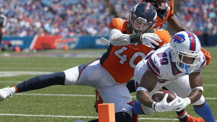 Bills receiver Jamison Crowder (80), is pushed out just short of the goal line by Denver linebacker